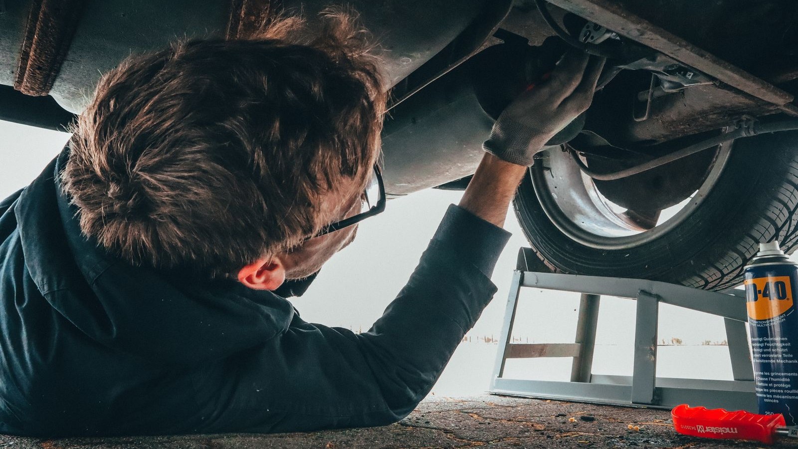 Mechanic working under a vehicle at Ridgeway Auto